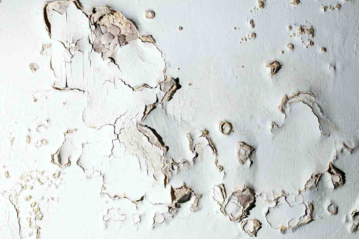 Close up of blistering plaster on interior walls caused by rising damp